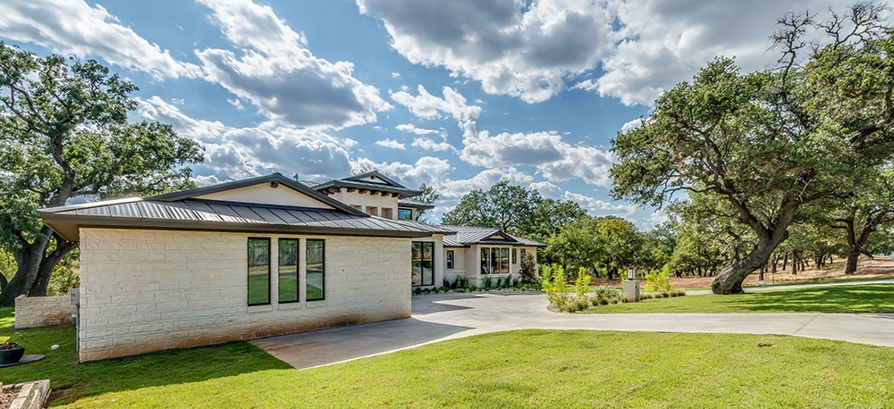 Exterior of a home with trees and shrubs